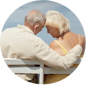 Image of senior man and woman sitting on park bench. 